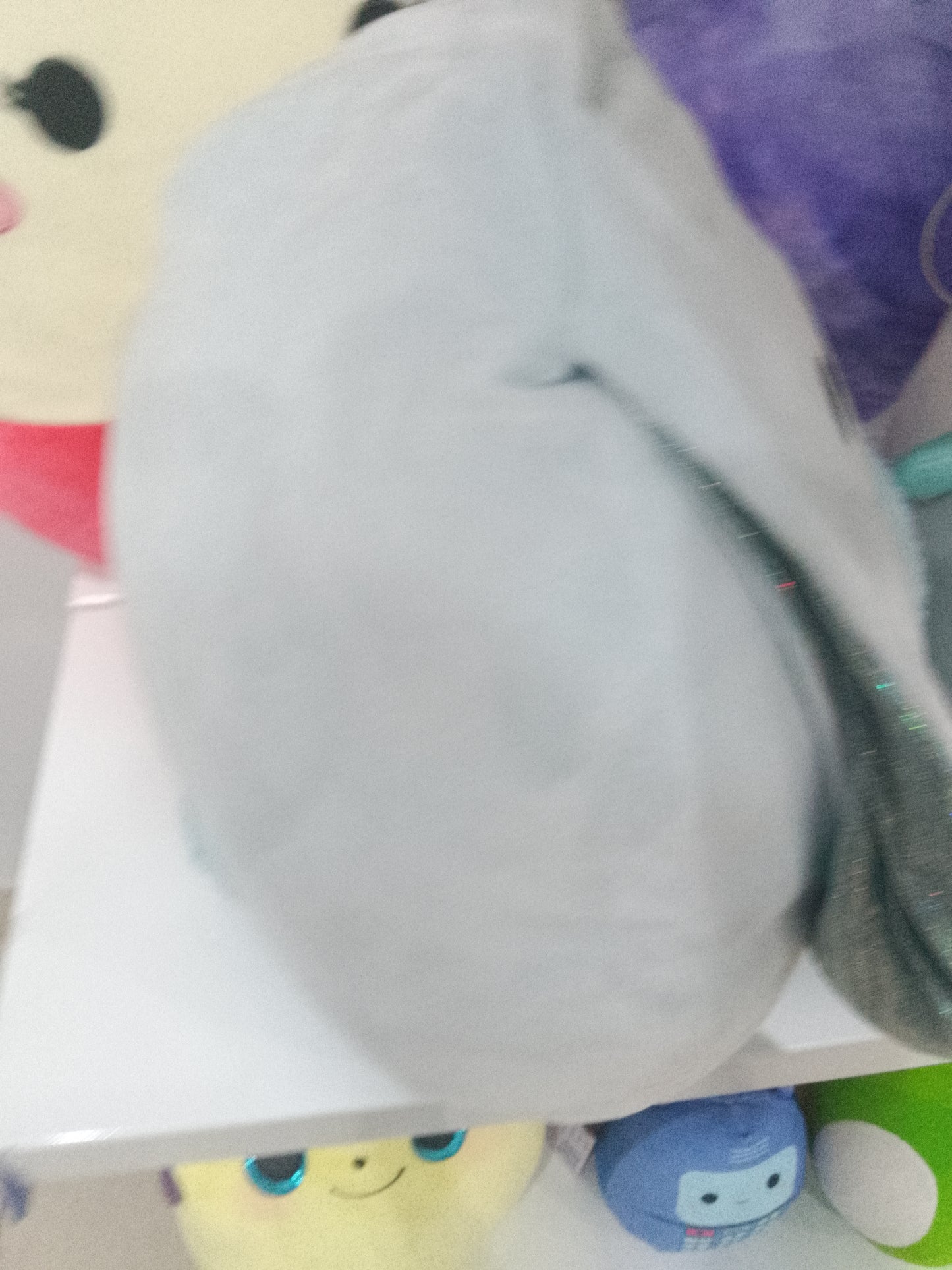 Squishmallows Bastian the Winking Blue Bunny plush toy.