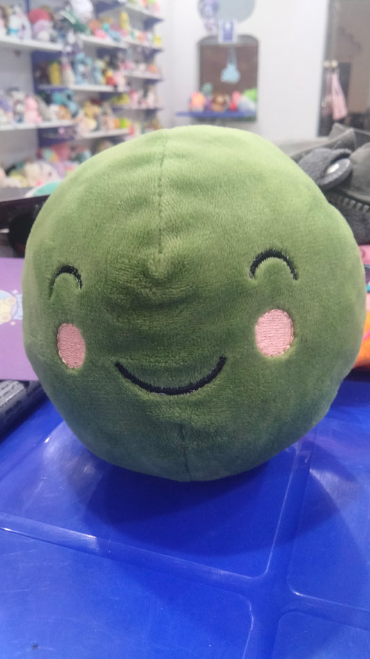 green plush toy that resembles a Brussels sprout or a slime character.