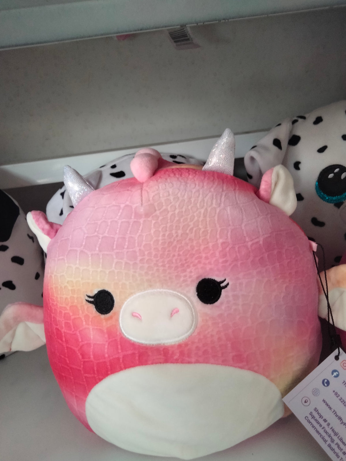 Squishmallows Celestina the Dragon plush toy.