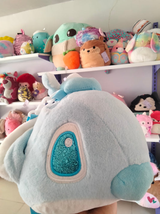 cartoon backpack features a plush toy