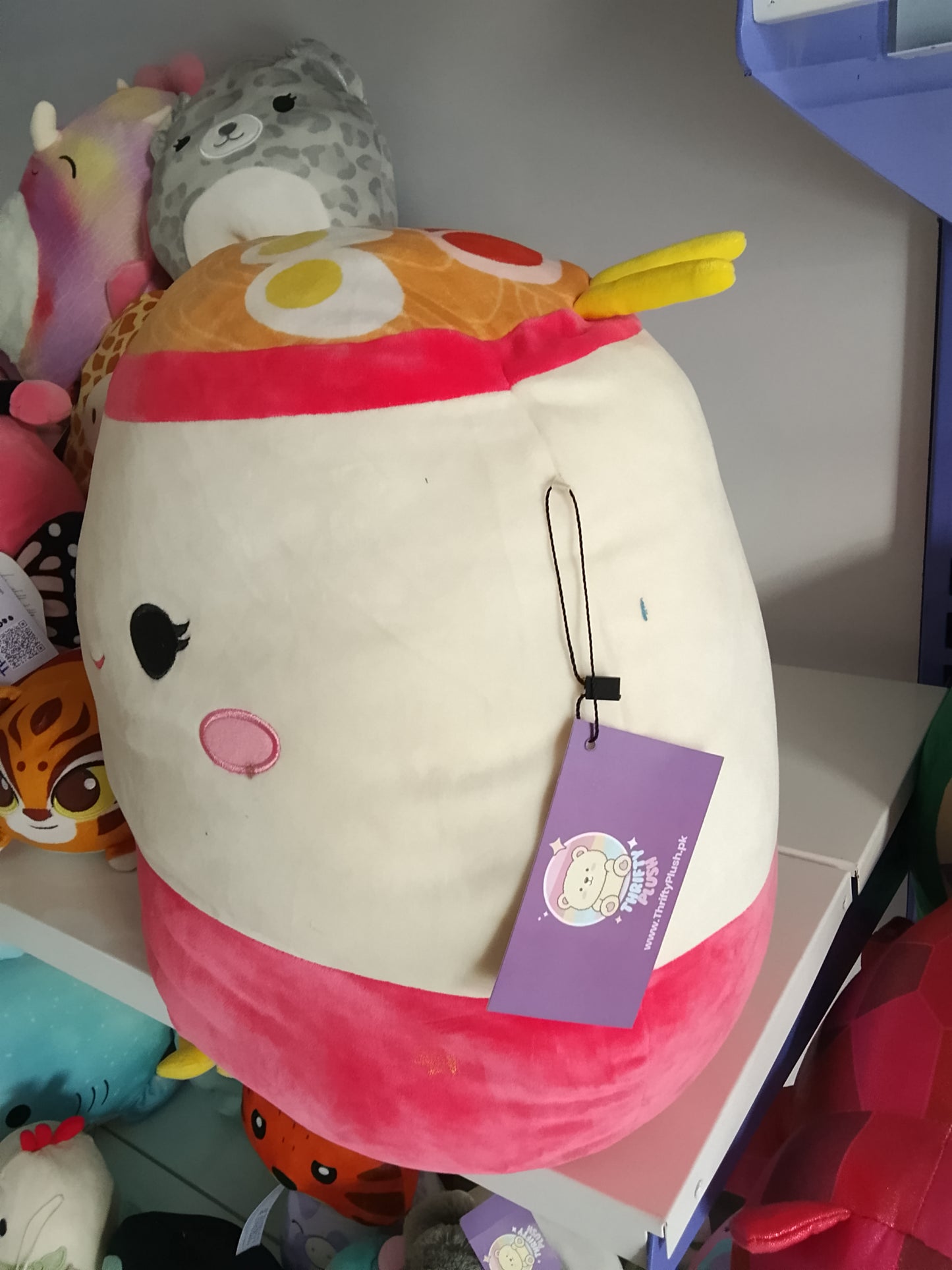 Squishmallows plush toy featuring the character Raisy the Ramen.