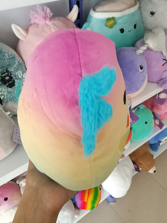 Squishmallows Flip-A-Mallows Aika the Axolotl plush rainbow design and holding a French fry carton.