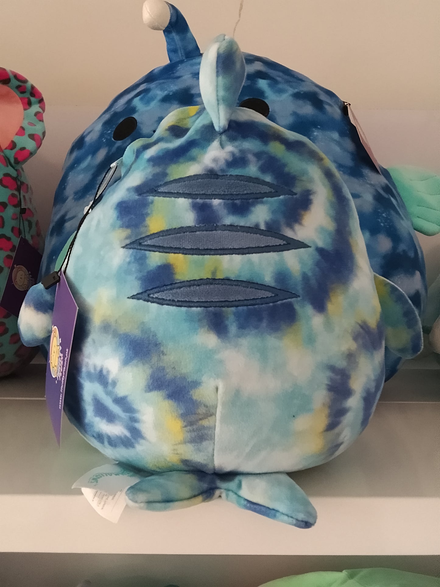 Squishmallows Luther the Blue Tie-Dye Tiger Shark plush toy.