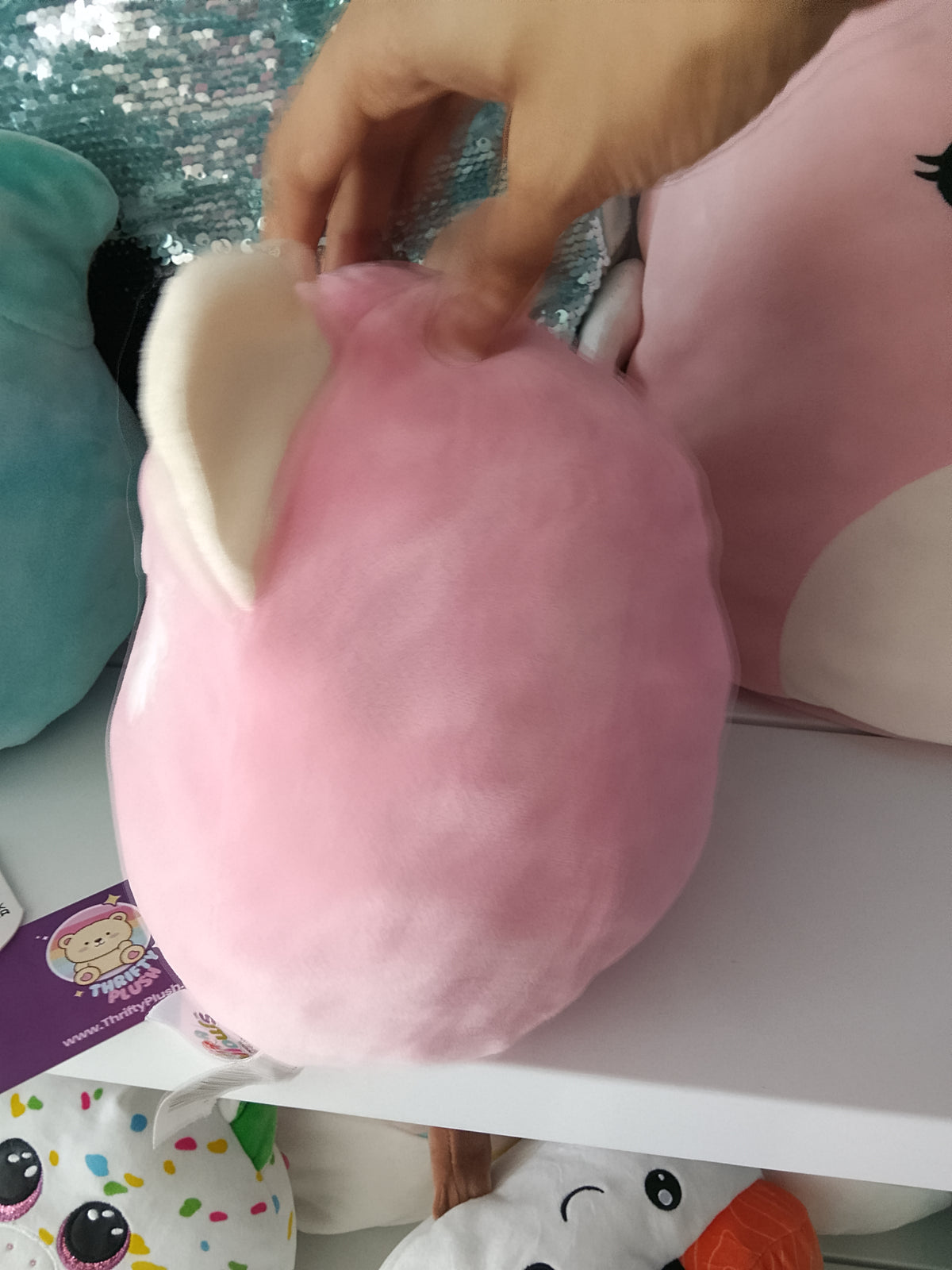 Squishmallows Flip-a-Mallow plush Dohna the Pink Panda and Mischa the Snow Leopard.