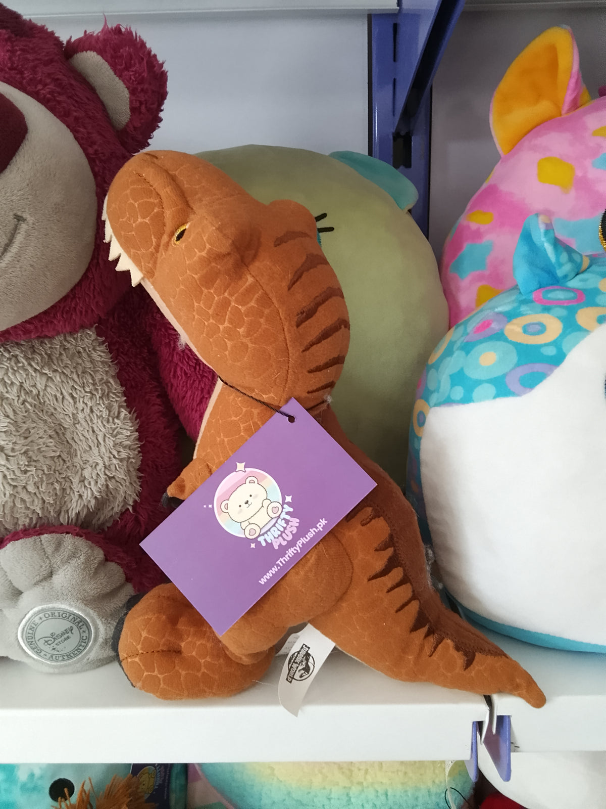 World T-Rex plush dinosaur toy.