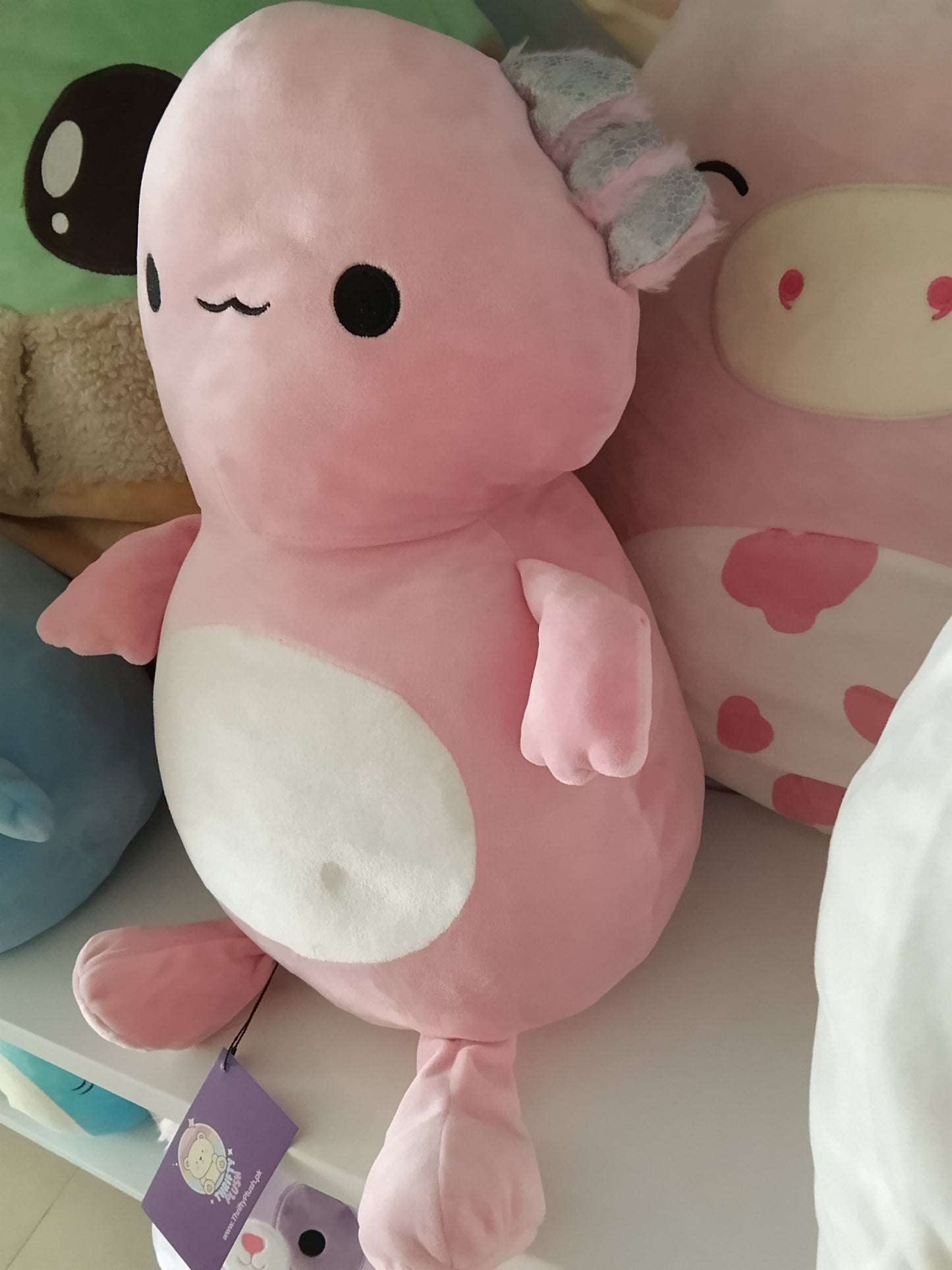 Squishmallows Archie the Axolotl plush toy.