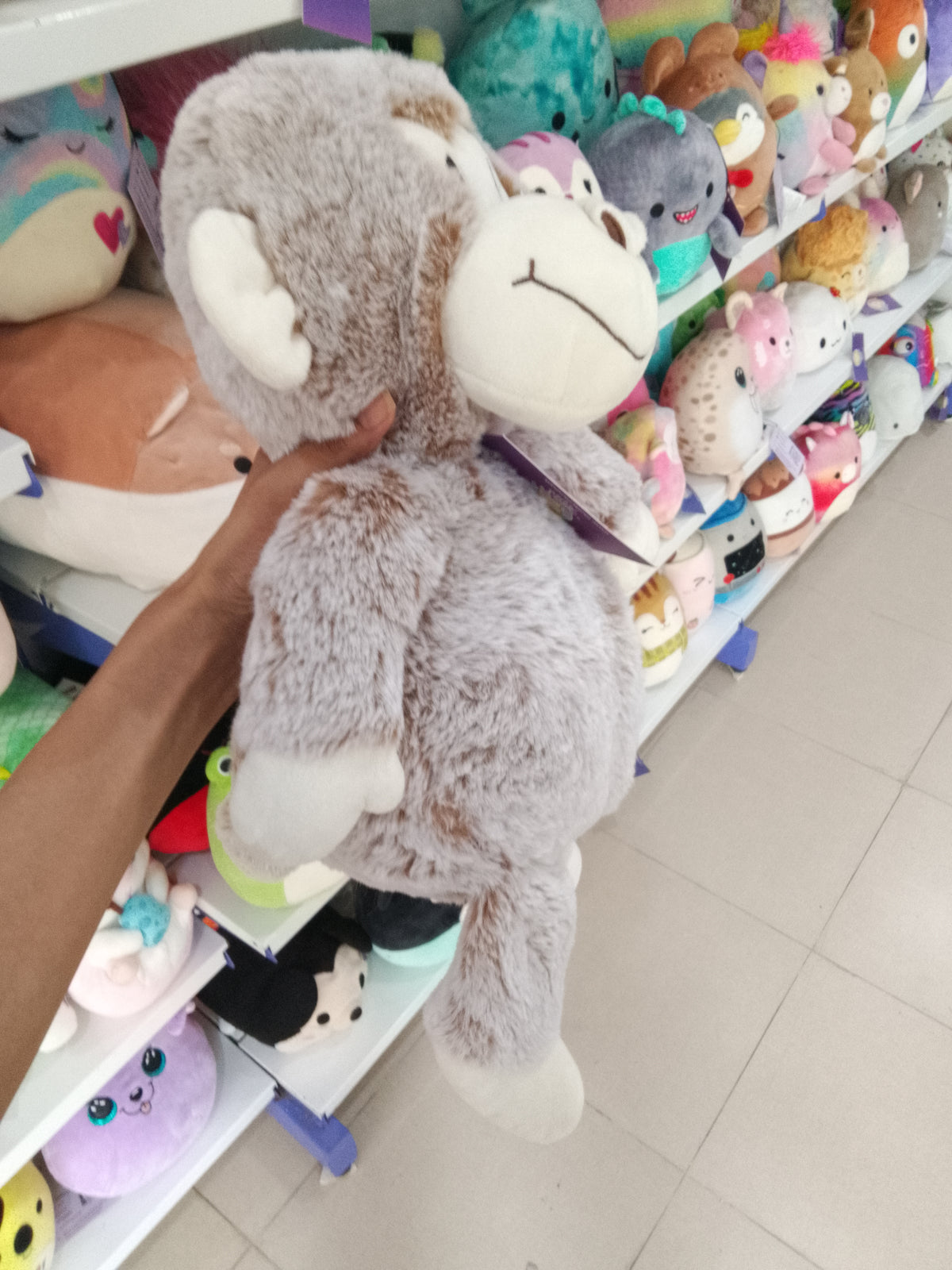 Kid Connection gray and white monkey plush toy.