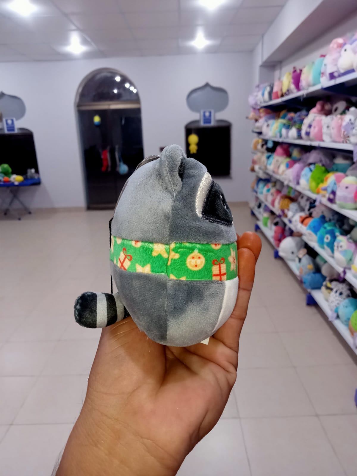 Rocky the Raccoon, a popular character from the Squishmallows Holiday collection.