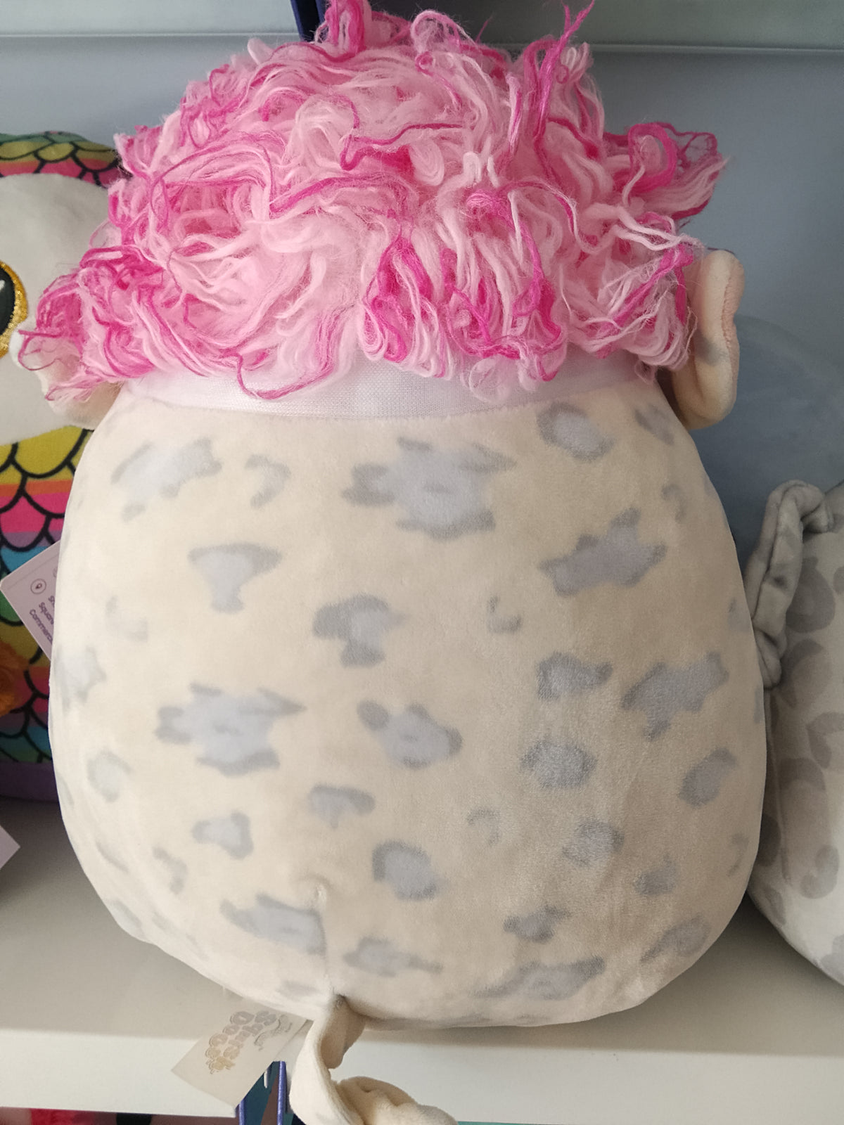 Squishmallows Squish-doos Rosie the Pig plush toy featuring a pink furry hairstyle.