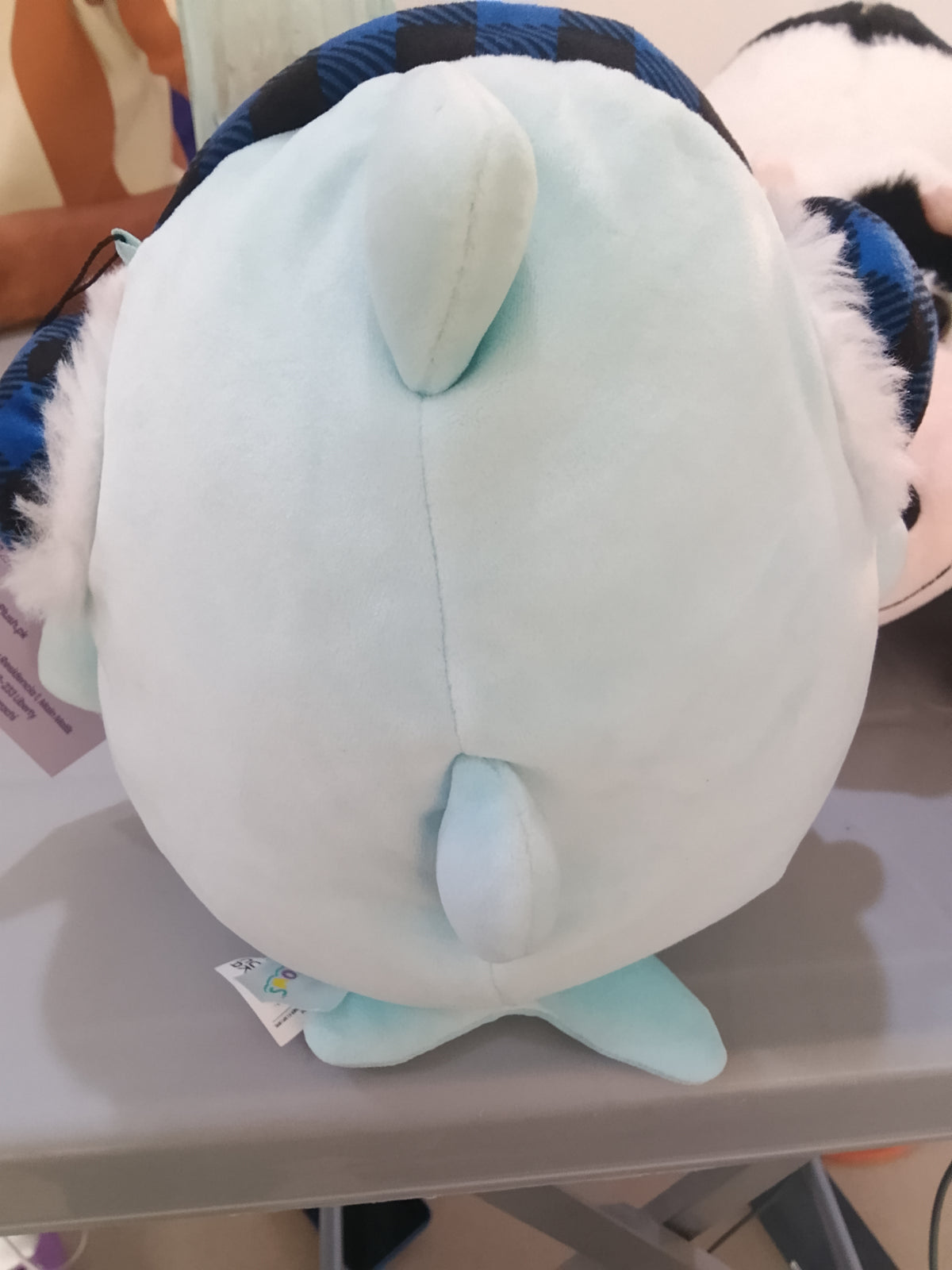 Squishmallows Sharon the Shark Holiday plush featuring festive earmuffs