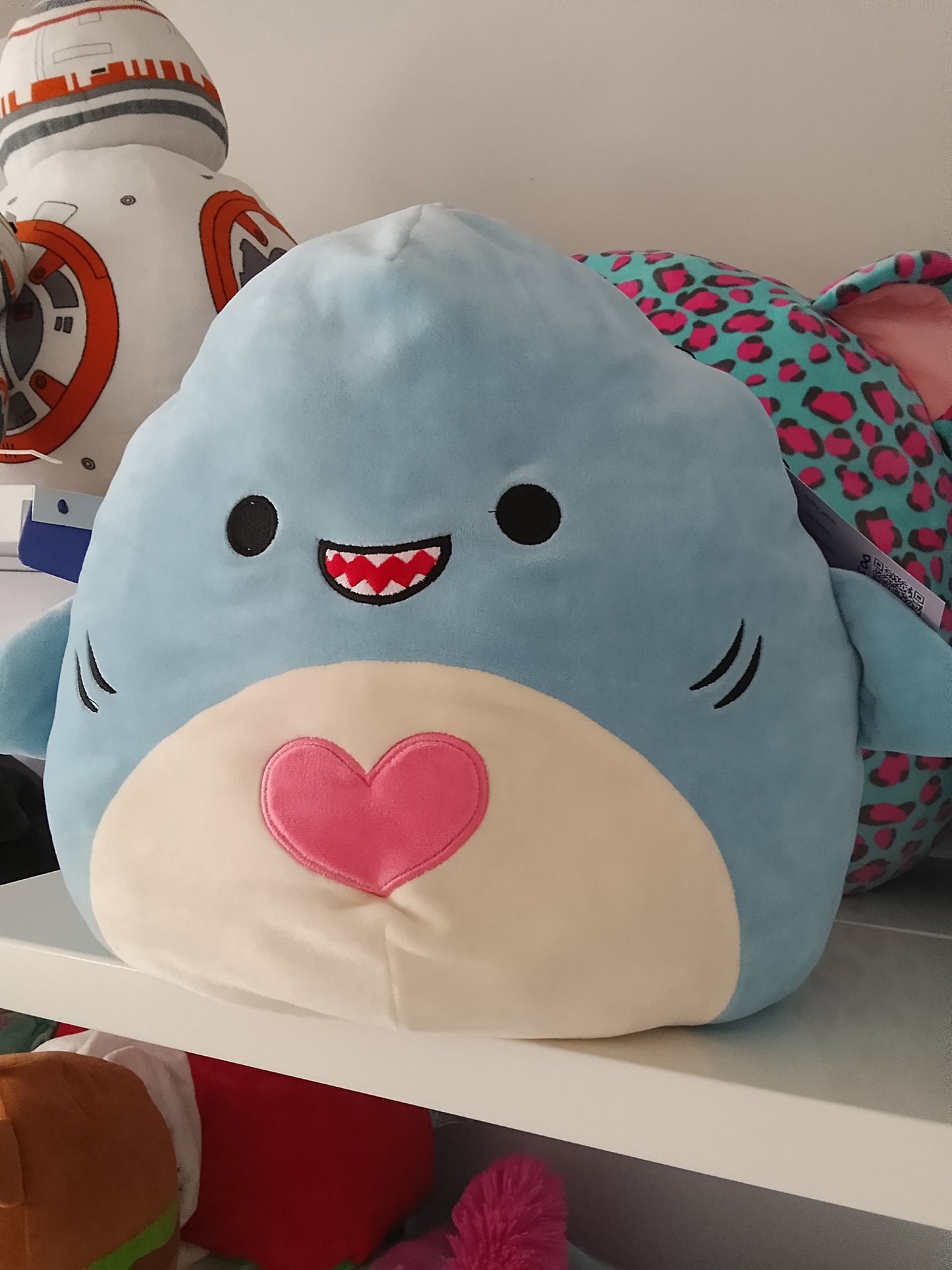 Squishmallows plush toy, specifically the character Rey the Blue Shark.