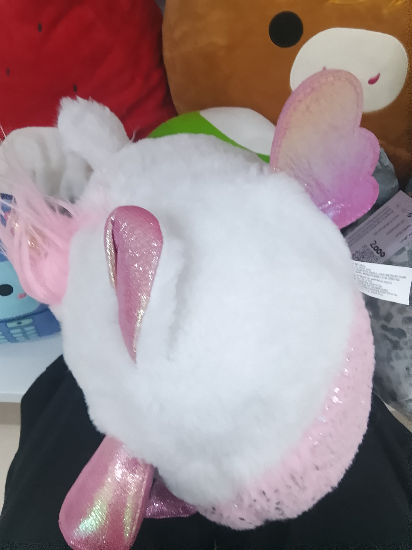 ZURU Rainbocorns Mermaidcorn kitten plush white furry face, pink hair, and a sparkly pink glitter heart.
