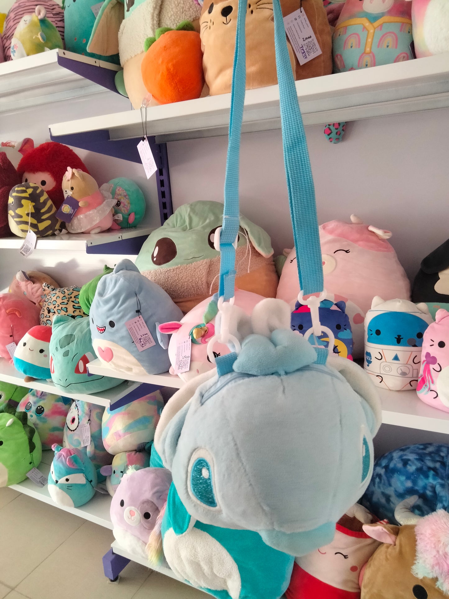 cartoon backpack features a plush toy