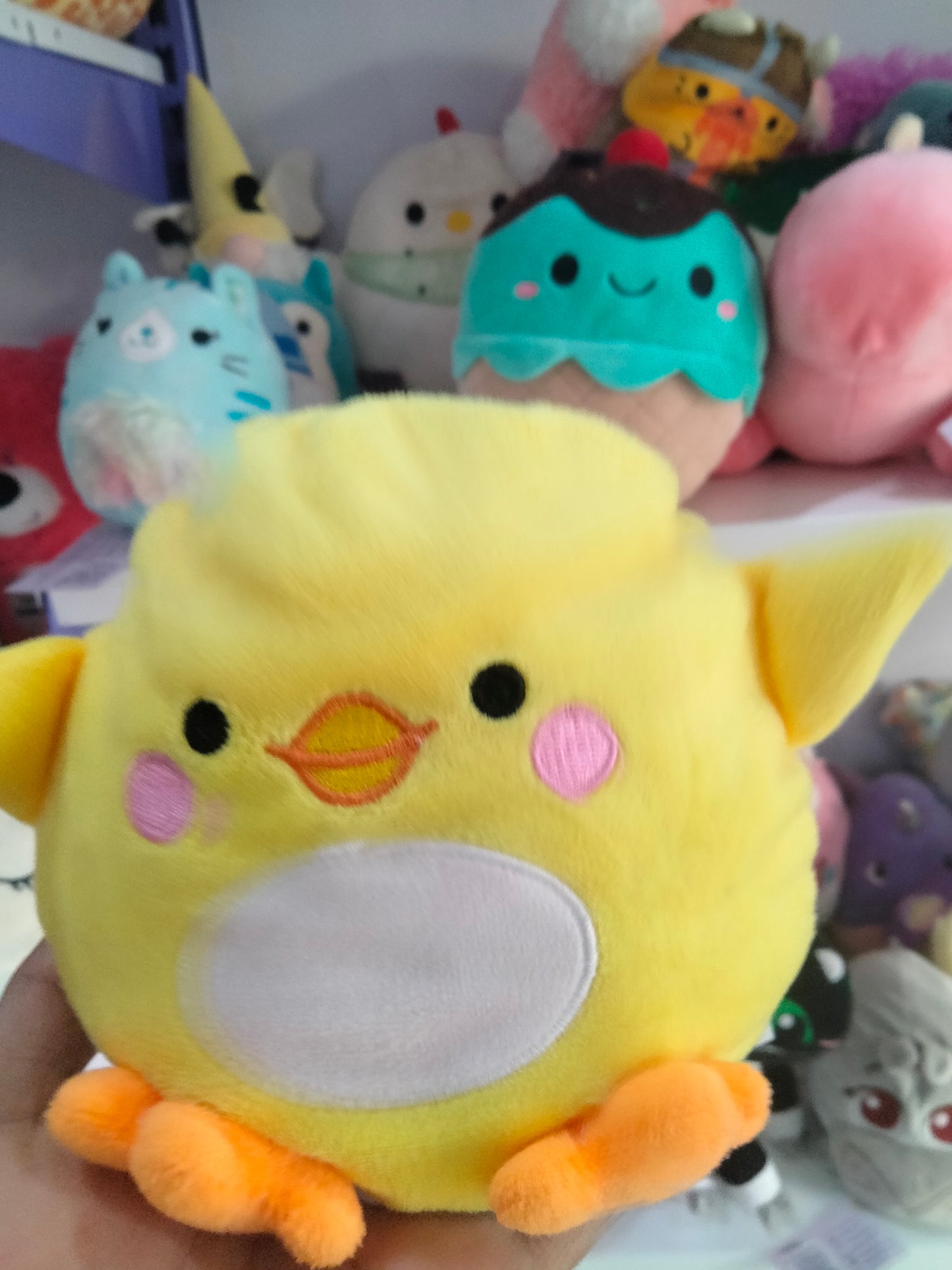 yellow Piu Piu stuffed animal plush toy by Aurora World.