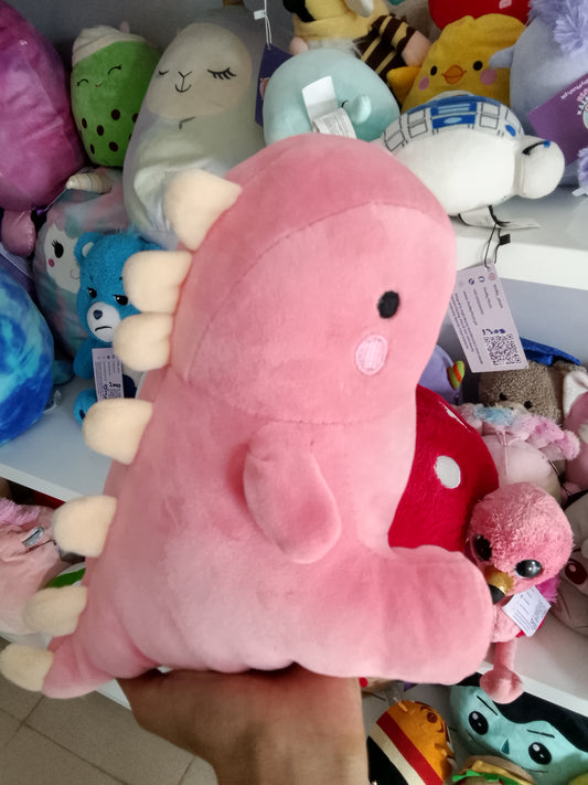 Yobush pink plush dinosaur toy holding a hear.