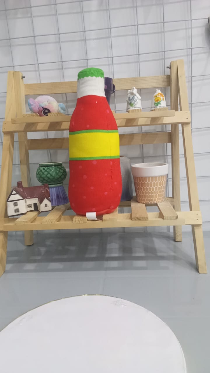 Plushie Resembling A Bottle Of Oranżada,