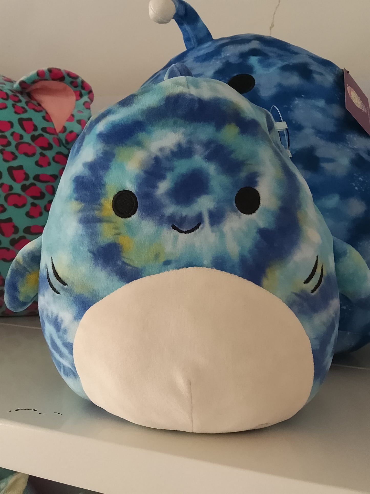 Squishmallows Luther the Blue Tie-Dye Tiger Shark plush toy.