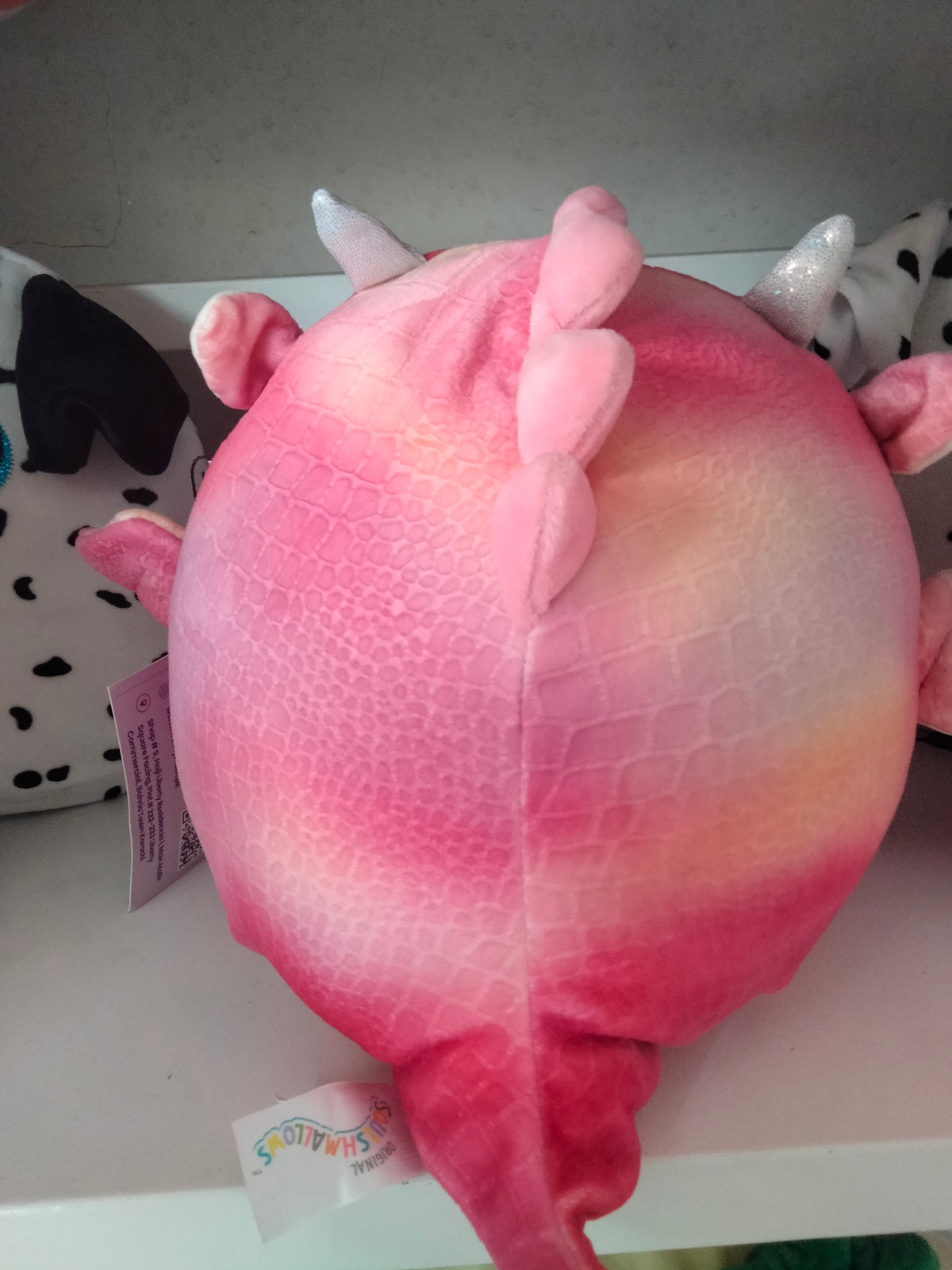 Squishmallows Celestina the Dragon plush toy.