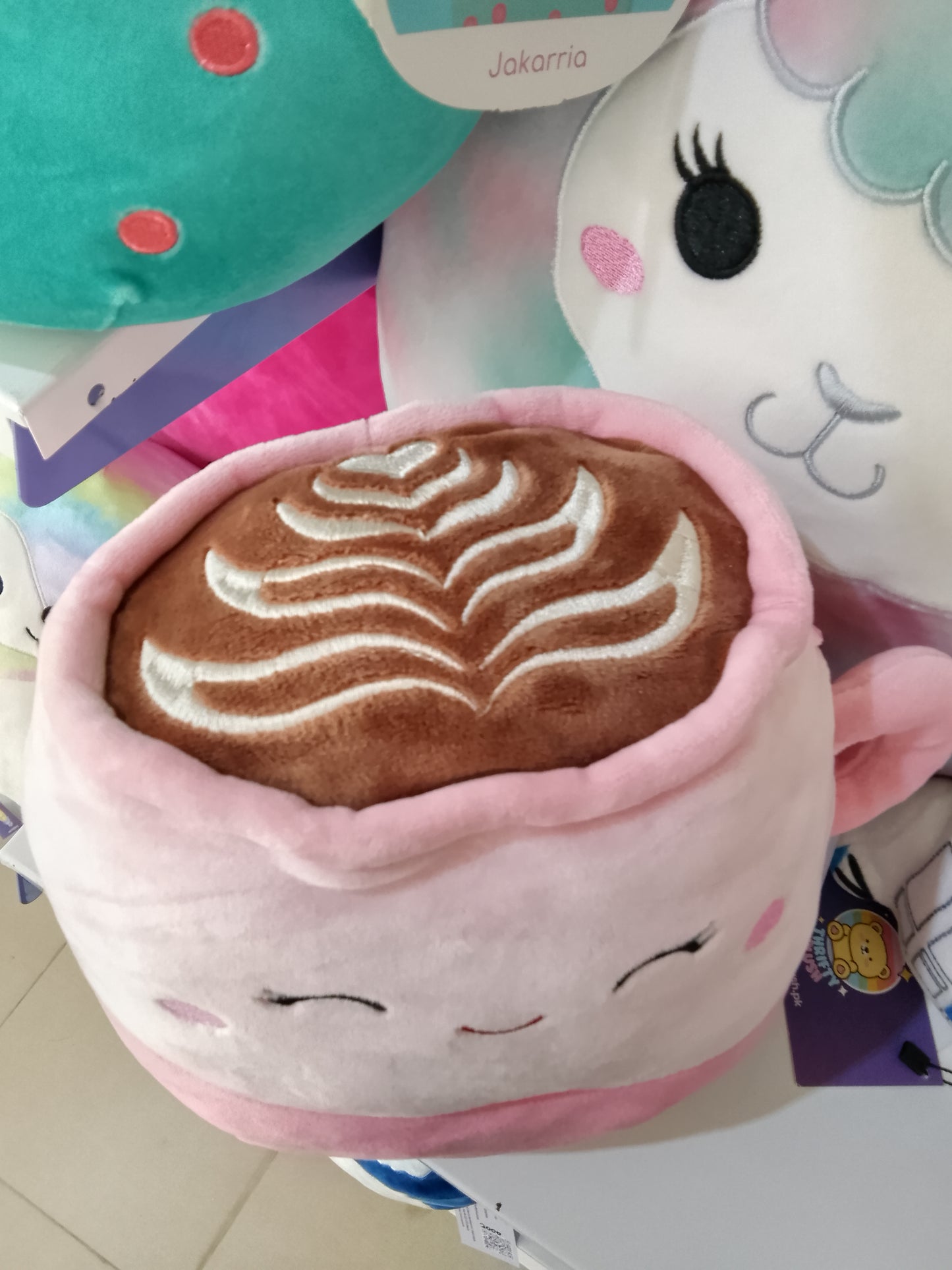 Squishmallow plush toy named Emery the Latte.