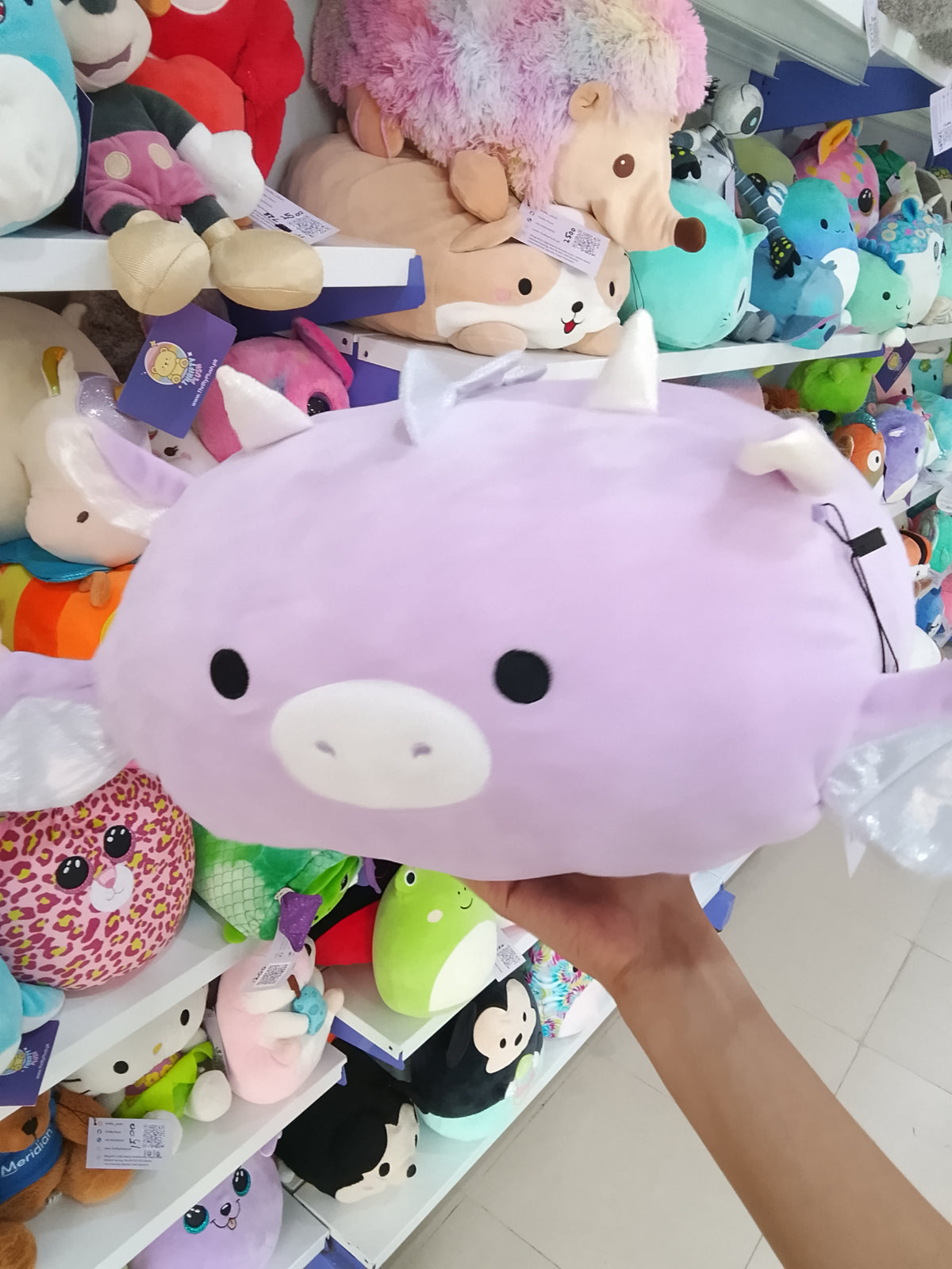 lavender Kellytoy Squishmallows Dina the Dragon stackable plush toy.