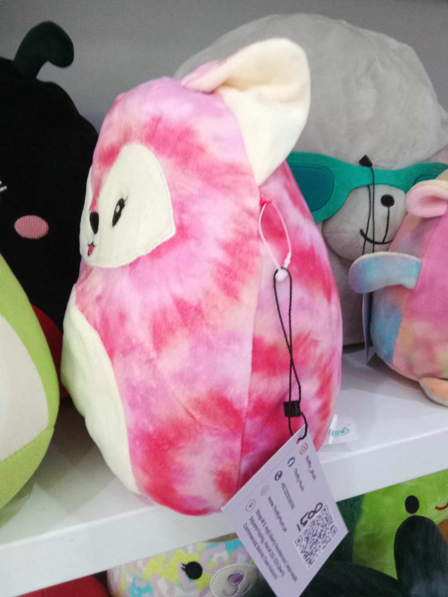 Squishmallow Kellytoy Sabine the Fox plush toy in a pink tie-dye pattern.