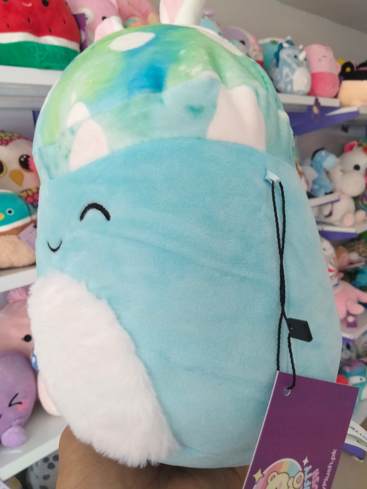 Mully the Teal Mushroom character wearing bunny ears.