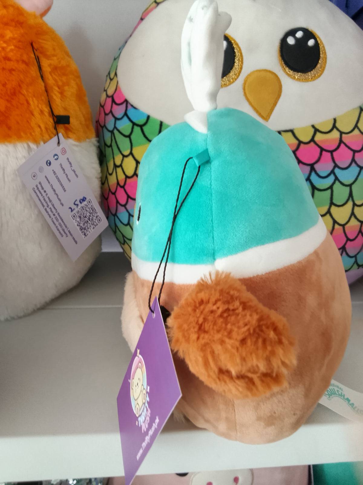 Squishmallows Daksa the Duck Easter plush bunny ears and a fuzzy belly.