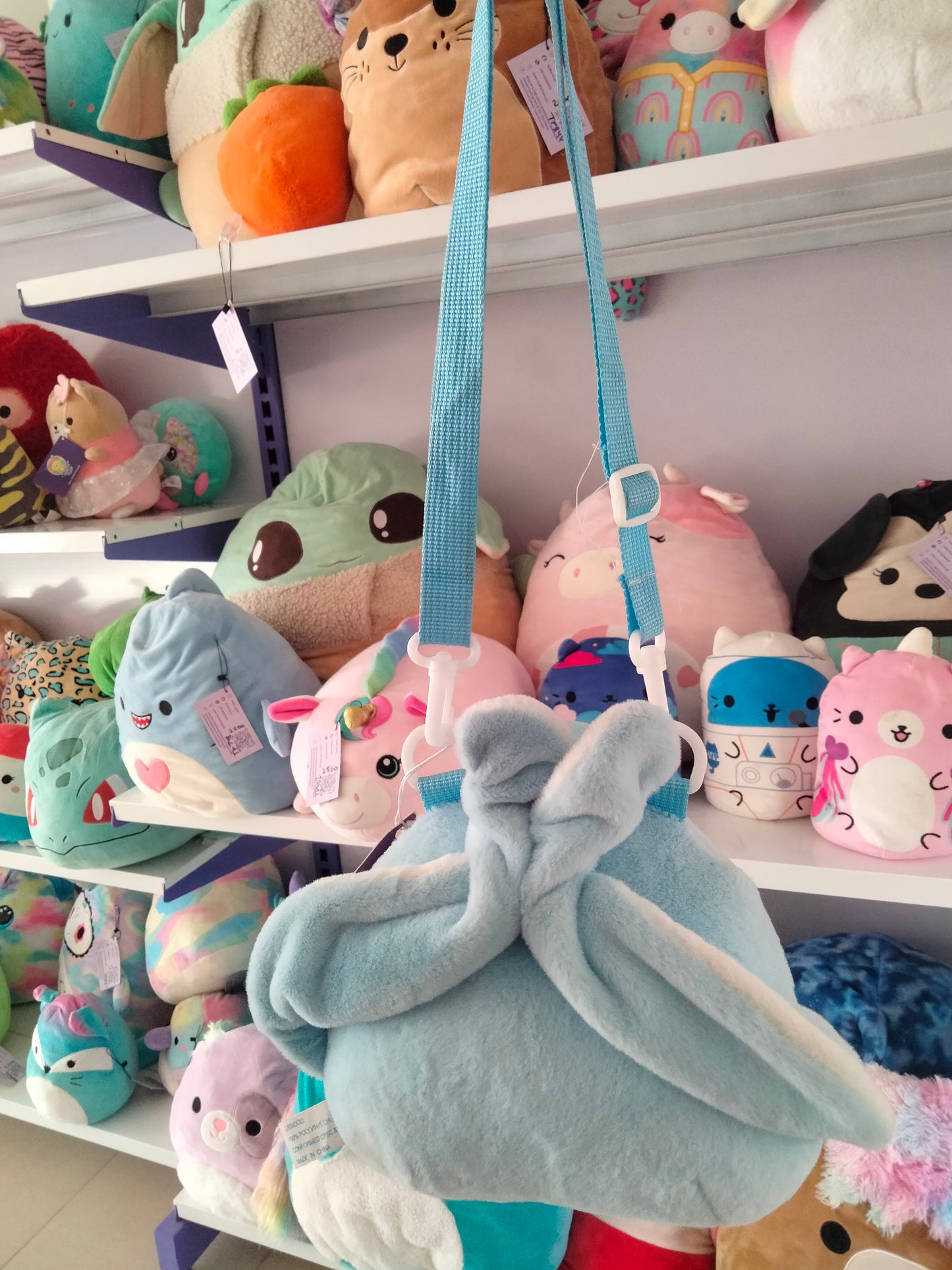 cartoon backpack features a plush toy