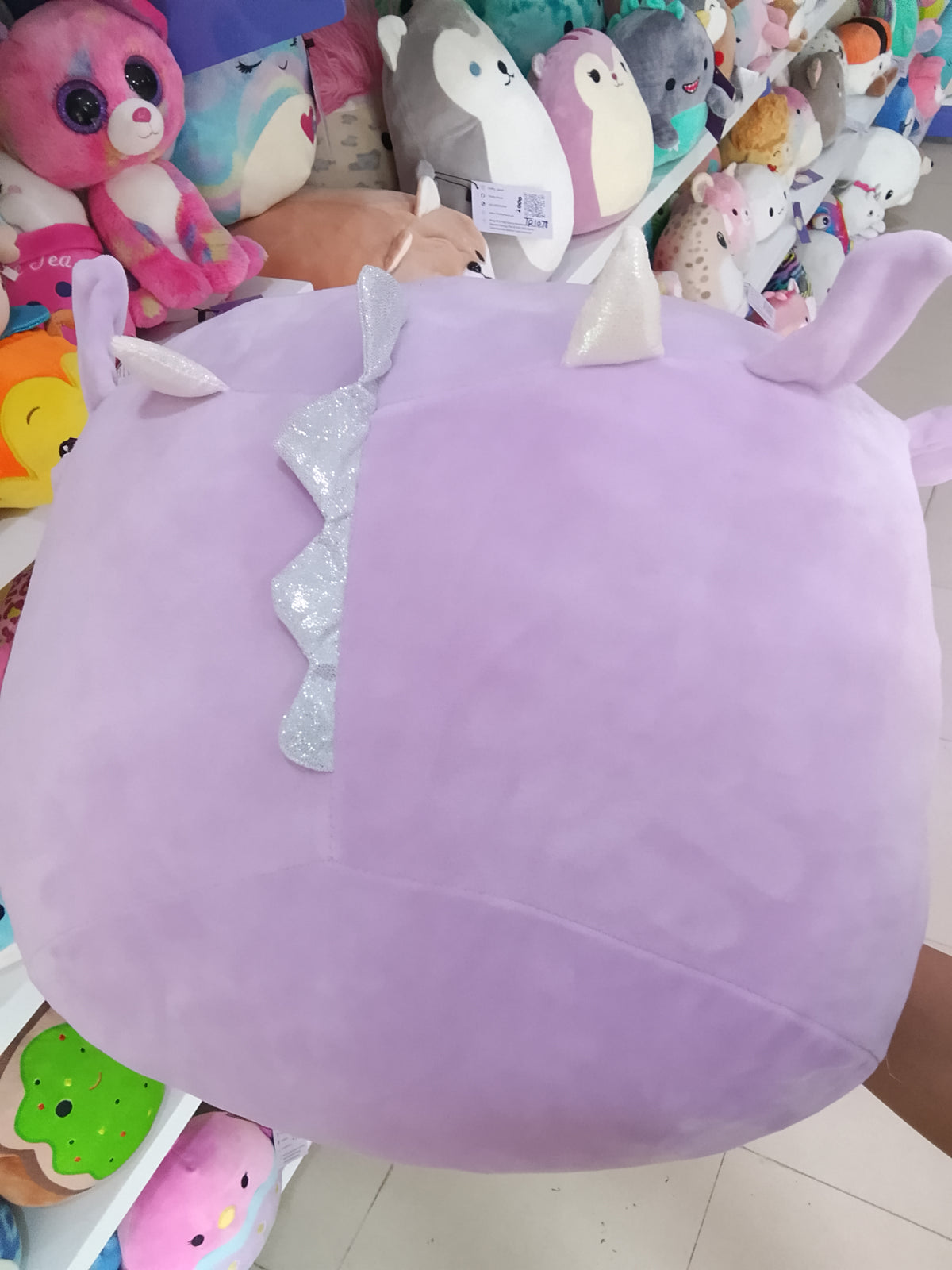 lavender Kellytoy Squishmallows Dina the Dragon stackable plush toy.