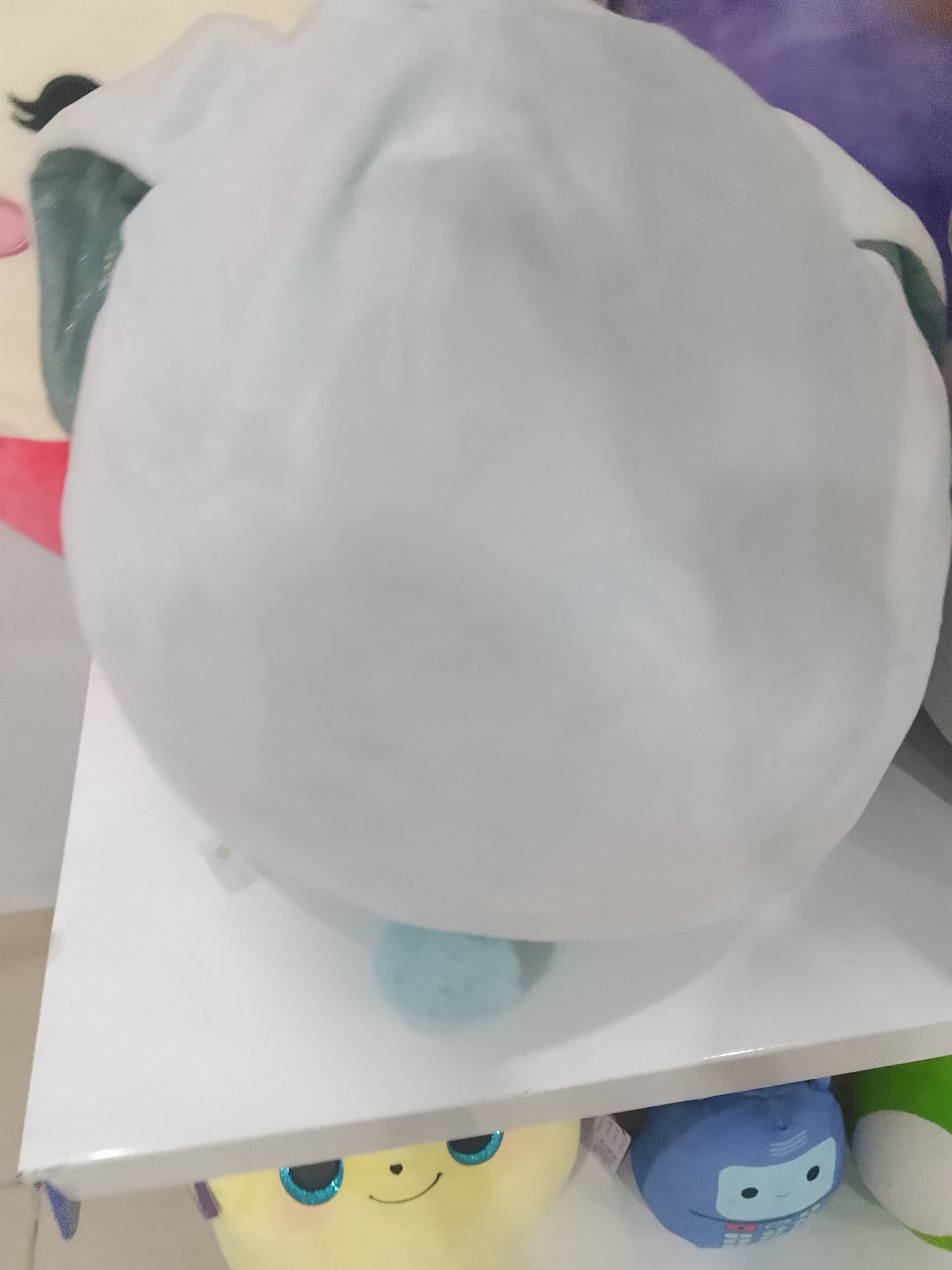 Squishmallows Bastian the Winking Blue Bunny plush toy.