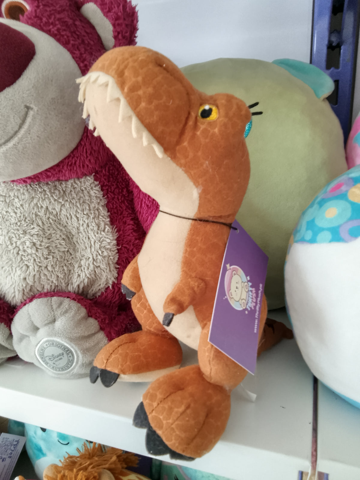 World T-Rex plush dinosaur toy.