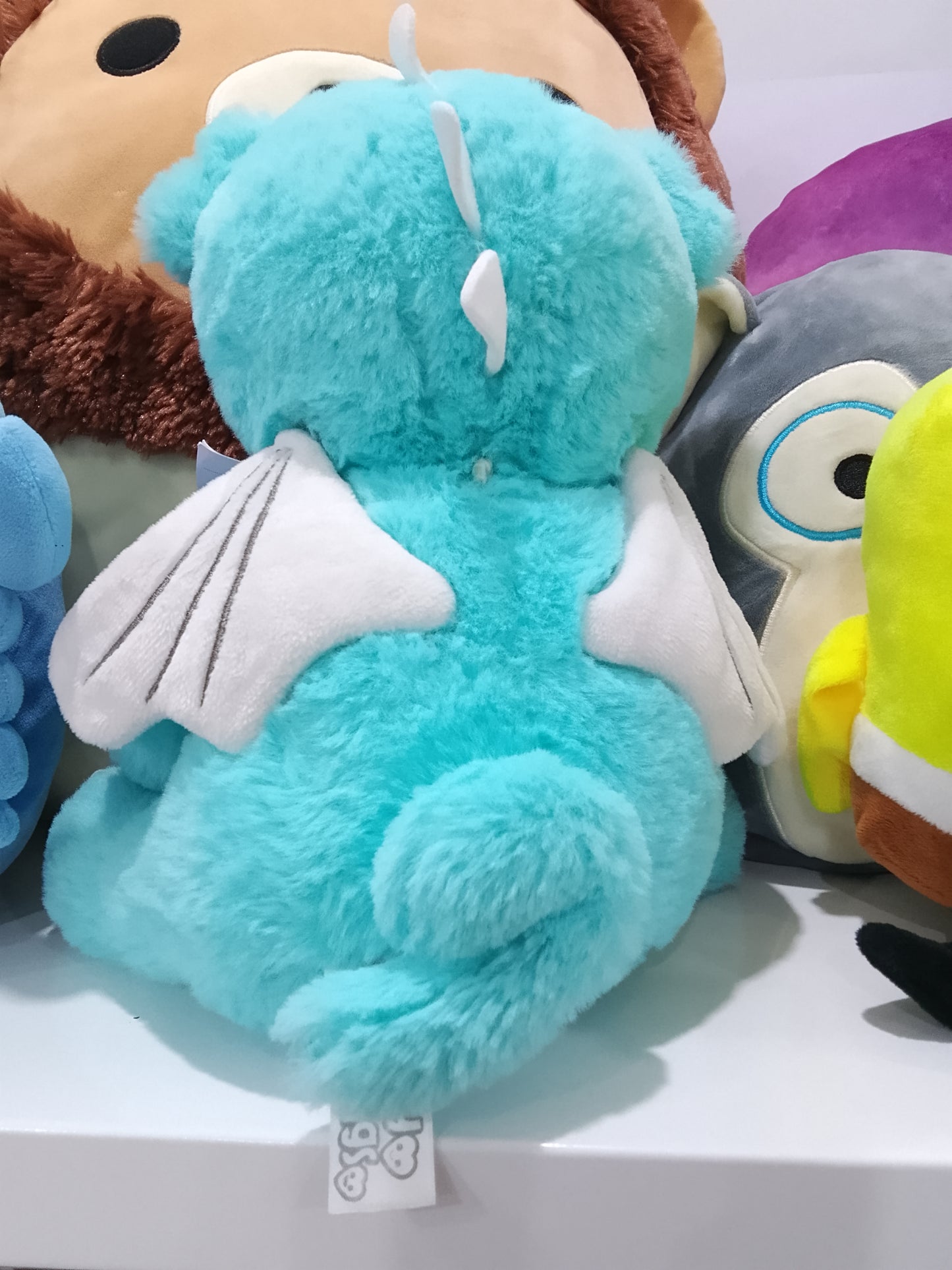 Blue dragon plush toy.