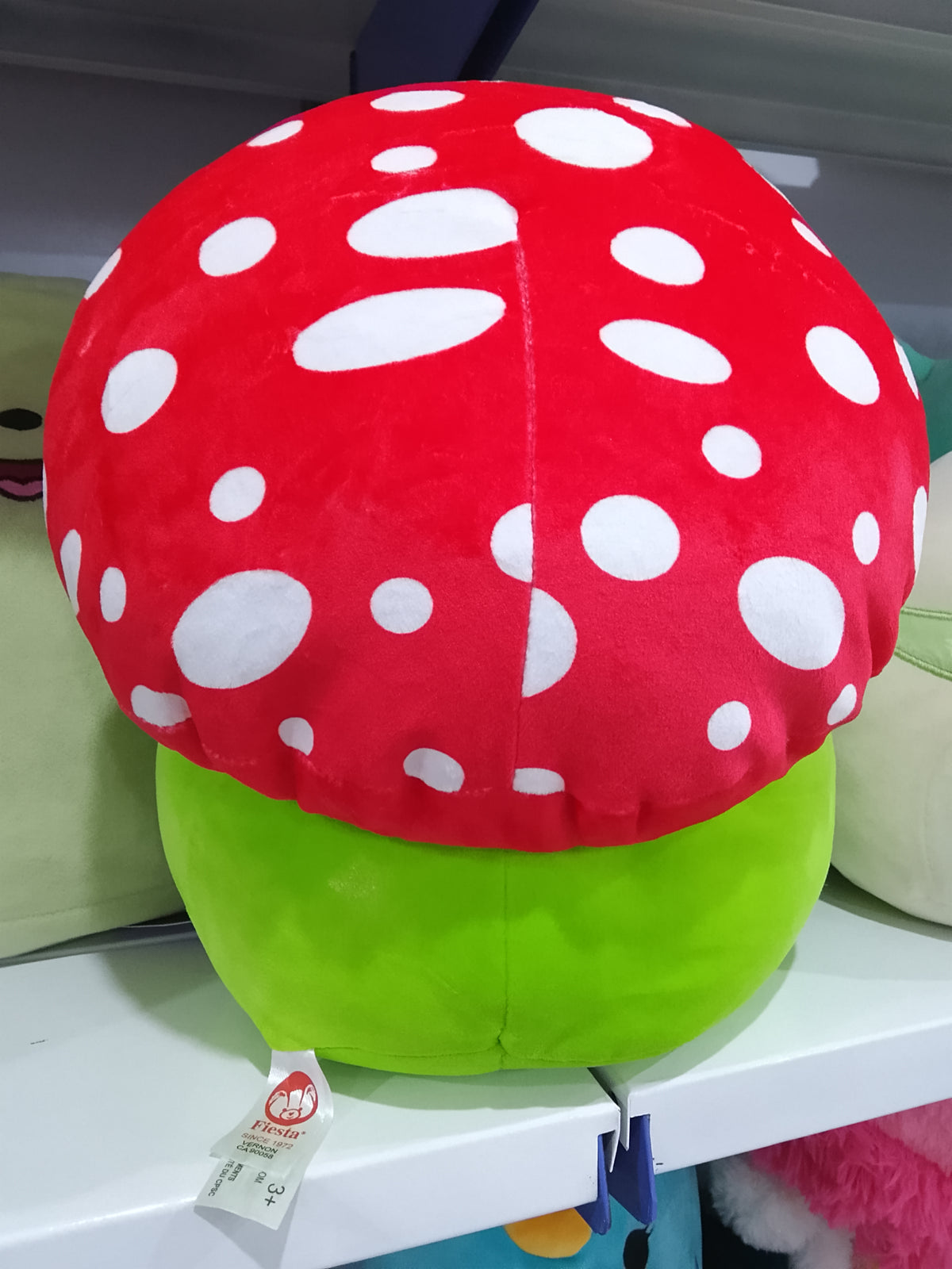Franklin the Green Mushroom Frog plush toy.