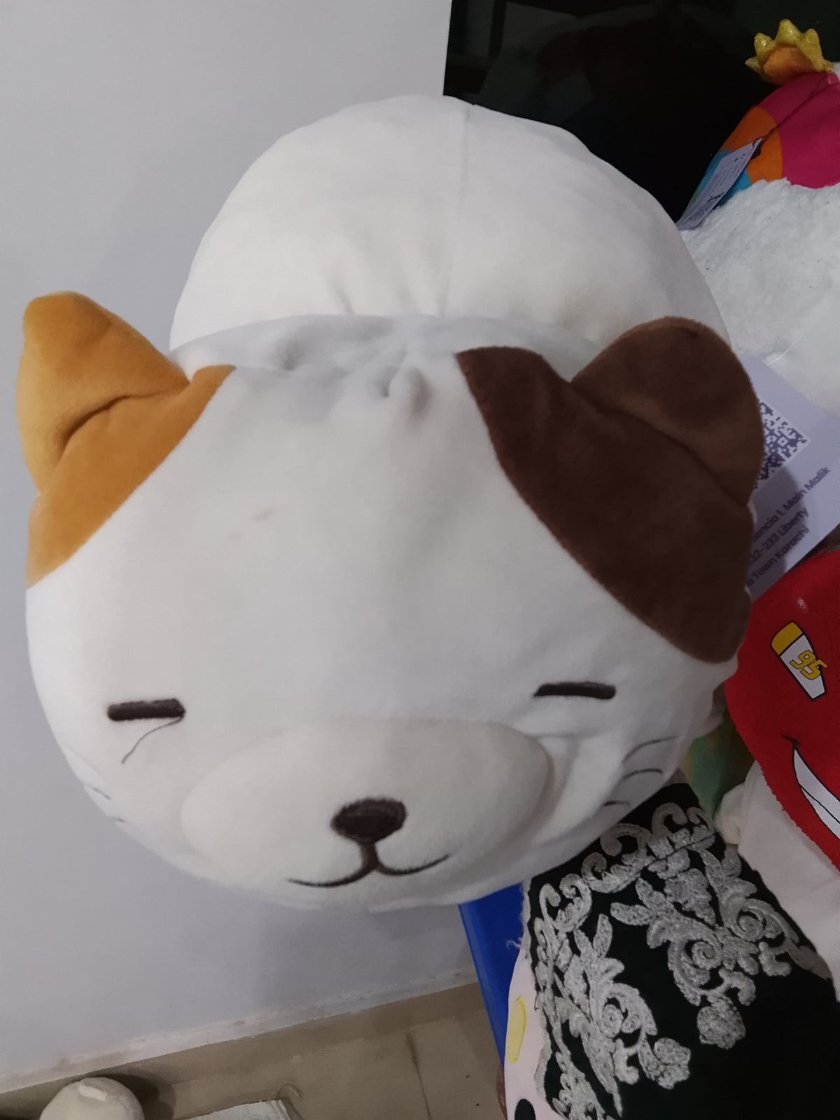 Miniso Standing Kitten plush pillow toy featuring a soft white and brown design.