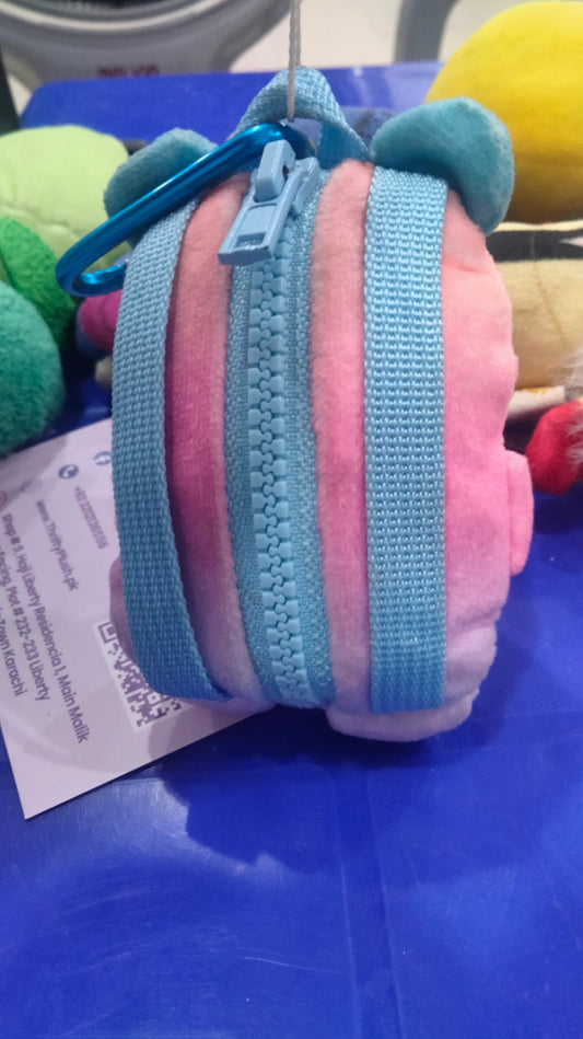 Zuru Real Littles Plushie Pet Backpack featuring a pink bear with blue ears.