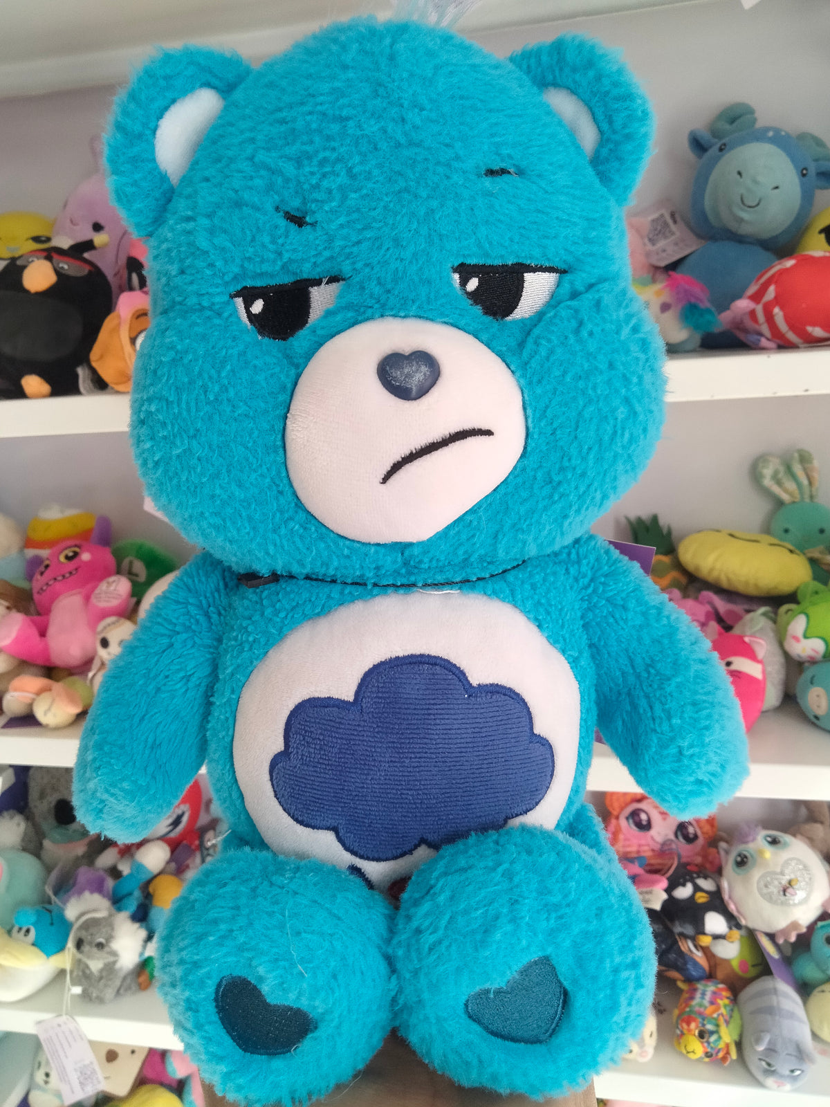 Care Bears Grumpy Bear plush toy.