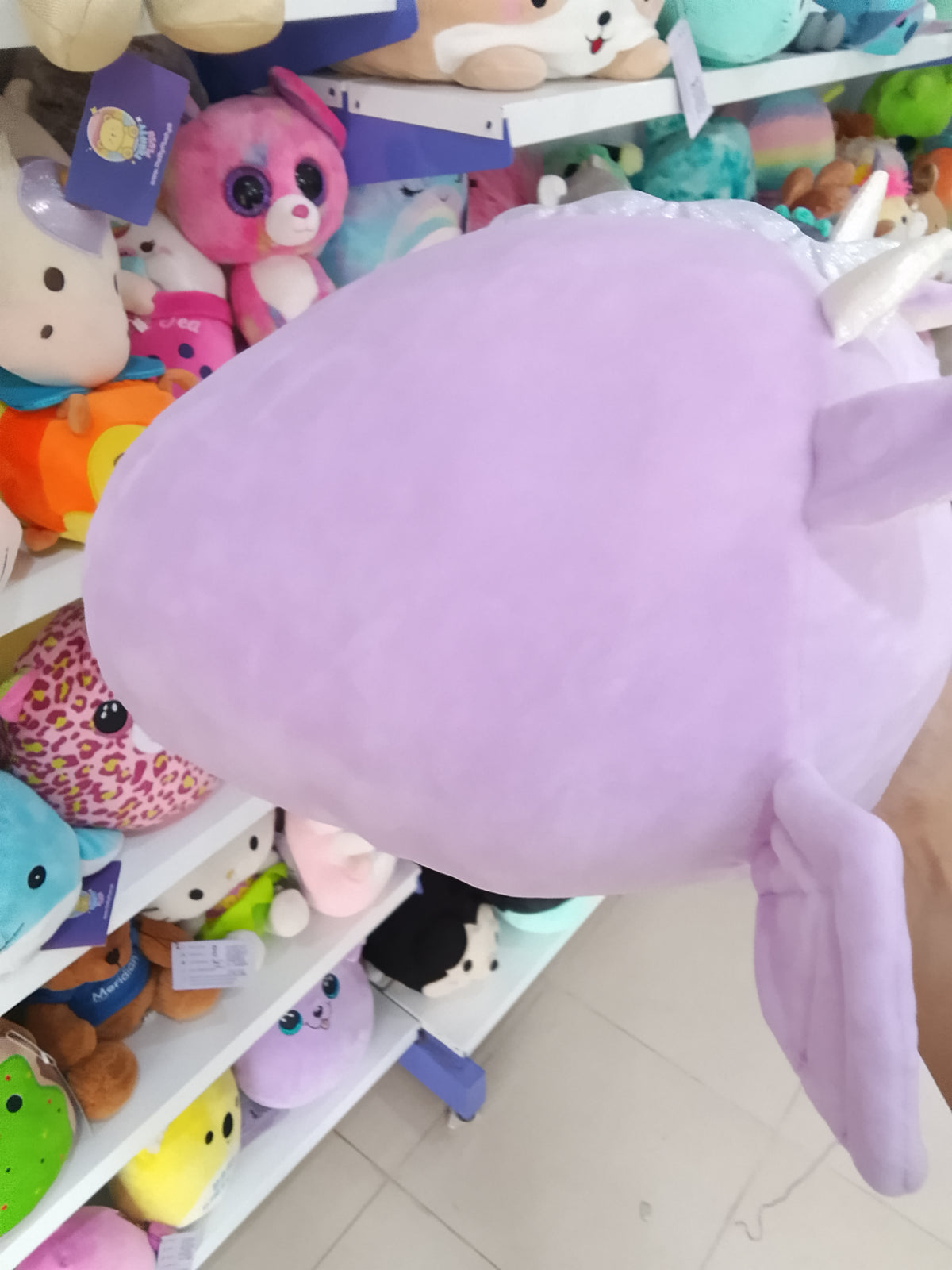 lavender Kellytoy Squishmallows Dina the Dragon stackable plush toy.