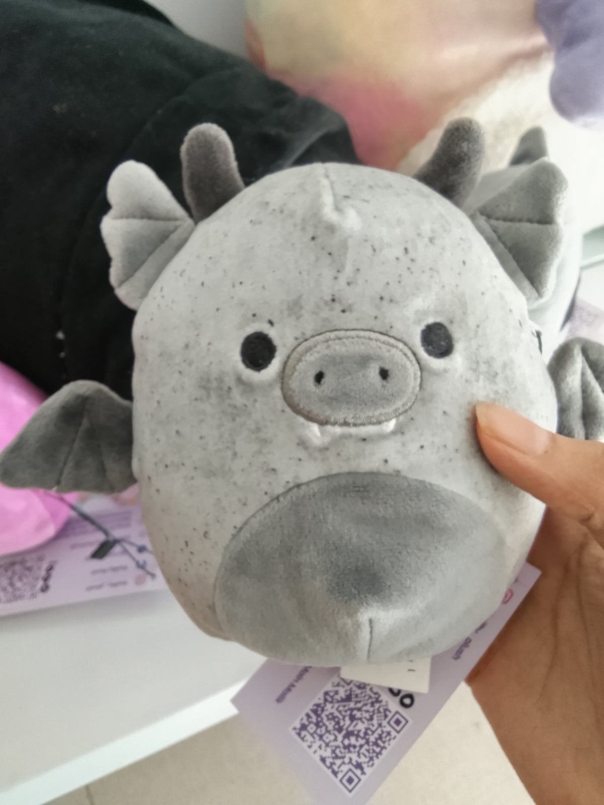 Squishmallows Halloween plush featuring Gio the Gargoyle in a speckled grey color.