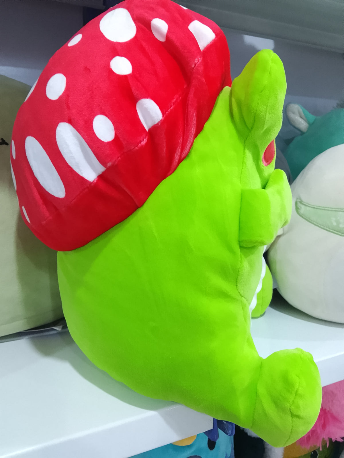 Franklin the Green Mushroom Frog plush toy.