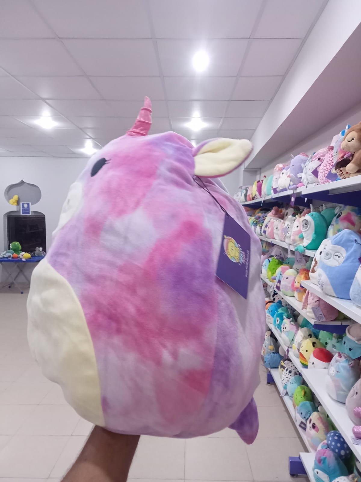 Lola the Unicorn from the Squishmallows brand.