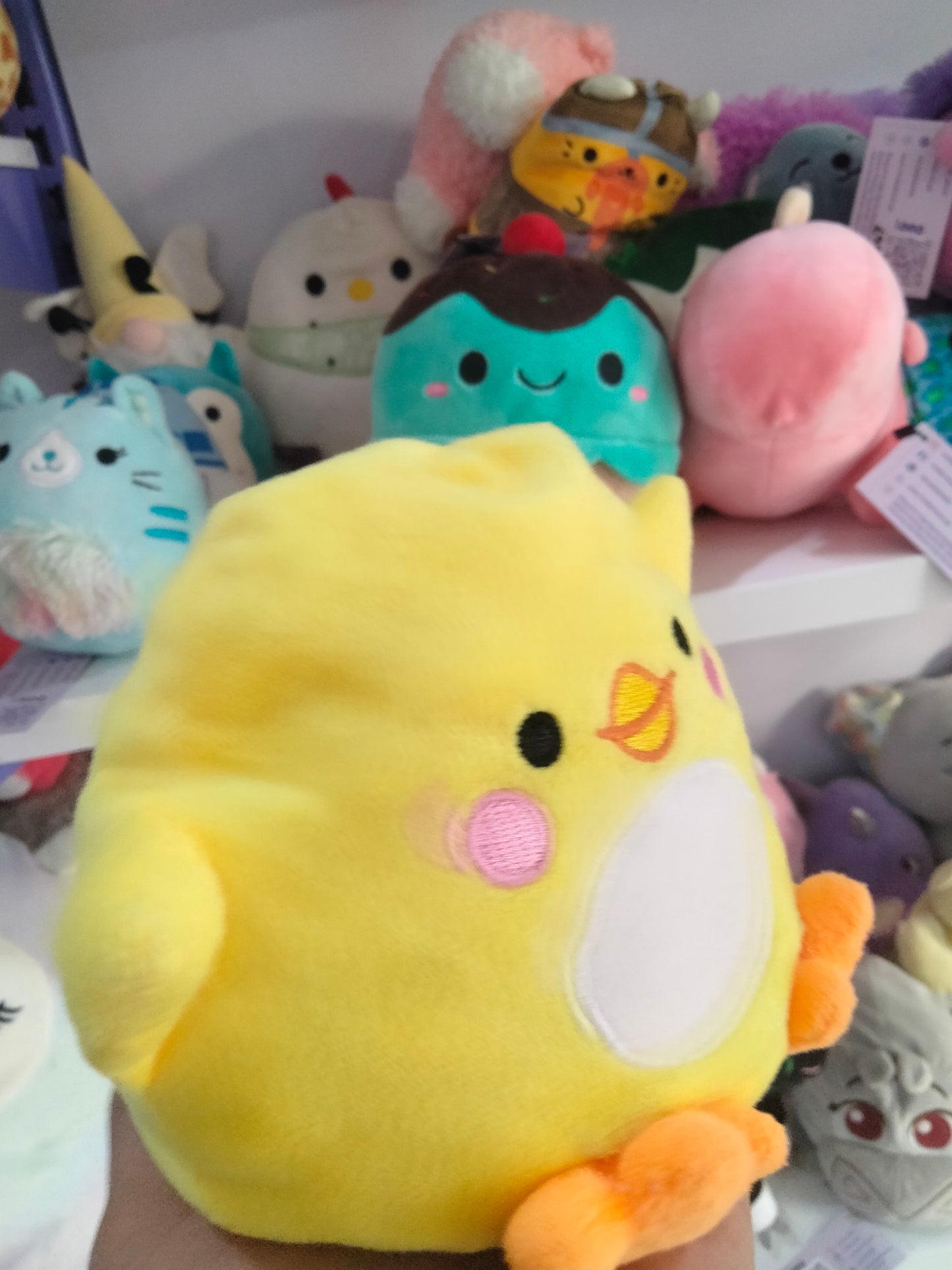 yellow Piu Piu stuffed animal plush toy by Aurora World.