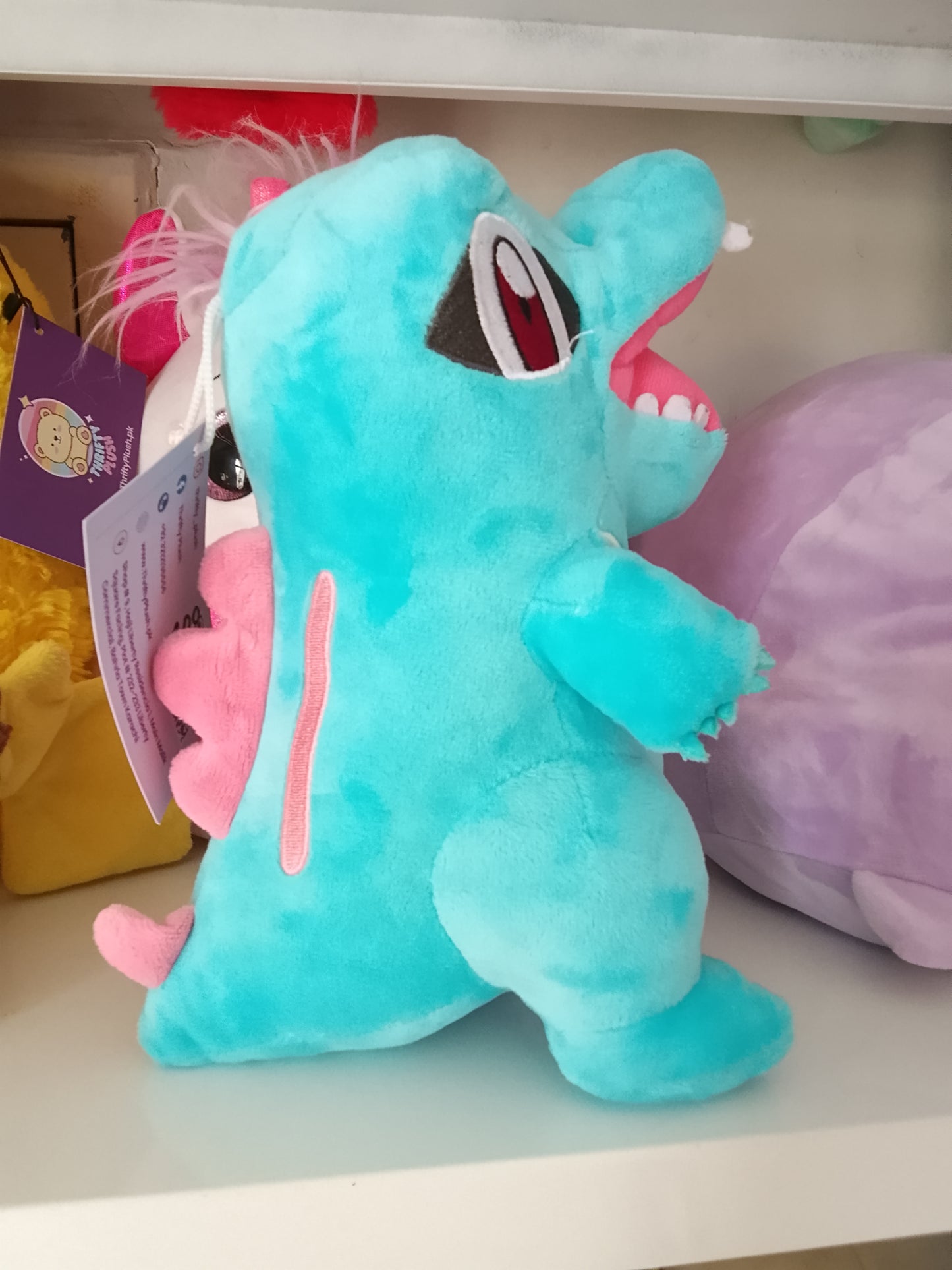 Totodile plush toy, a popular character from the Pokémon franchise.
