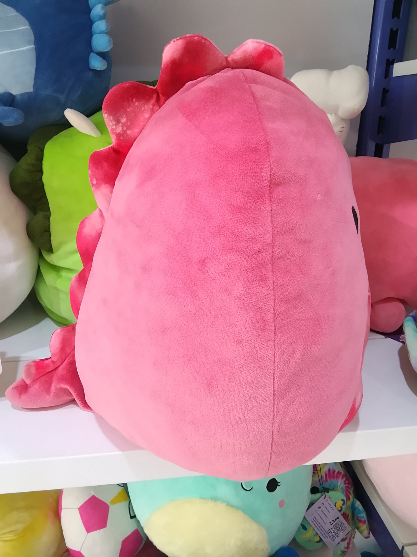 Squishmallows plush toy featuring the character Poleena the Red Dinosaur.