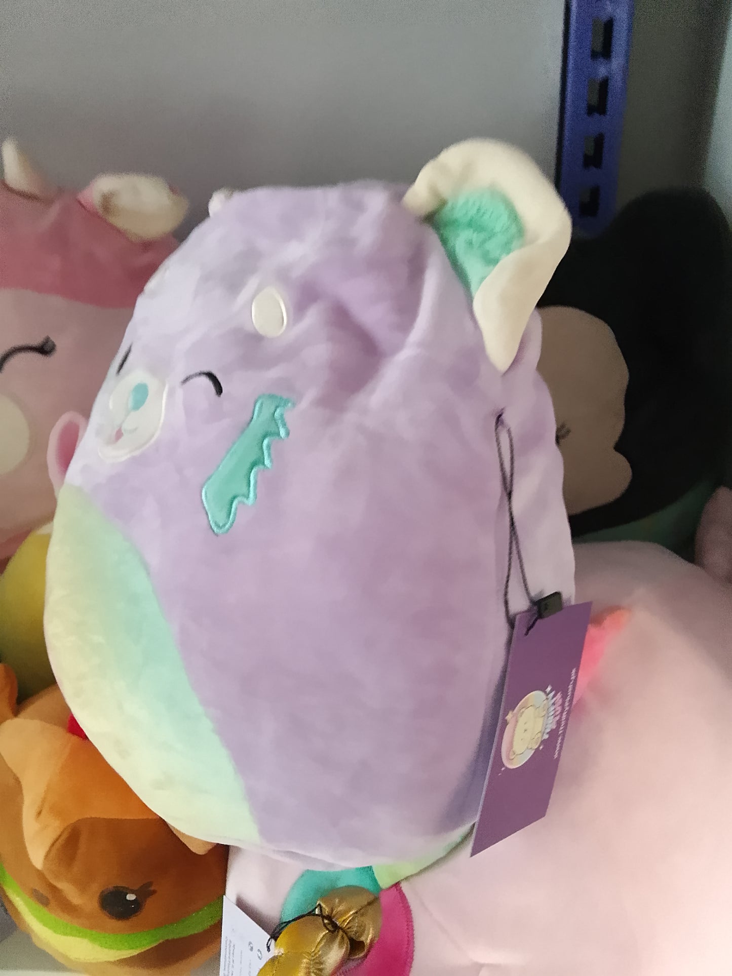 Squishmallows Lexis the Red Panda plush toy.