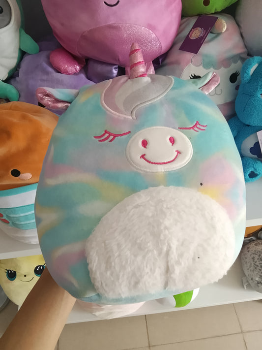 Squishmallows Kellytoys unicorn plush, possibly Rodina or Anouk Mystery Squad series, rainbow tie-dye pattern and a fluffy white belly.