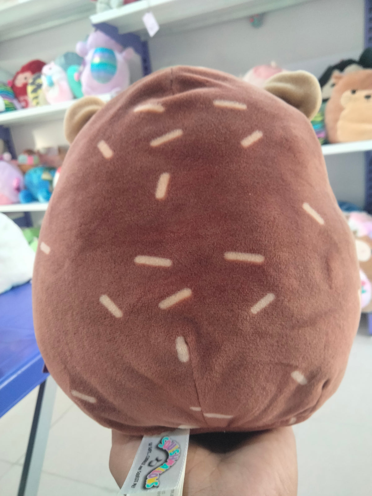Squishmallows Hans the Hedgehog brown plush toy.