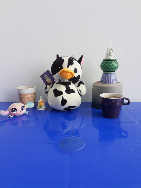 showcases a Plushie hybrid Of  A Cow And A Duck