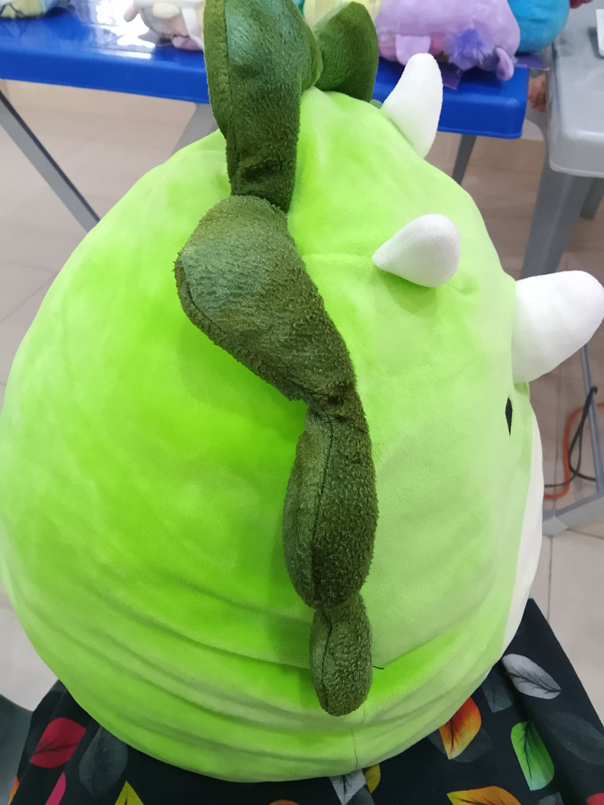 Squishmallows plush toy featuring Tristan the Green Triceratops dinosaur.