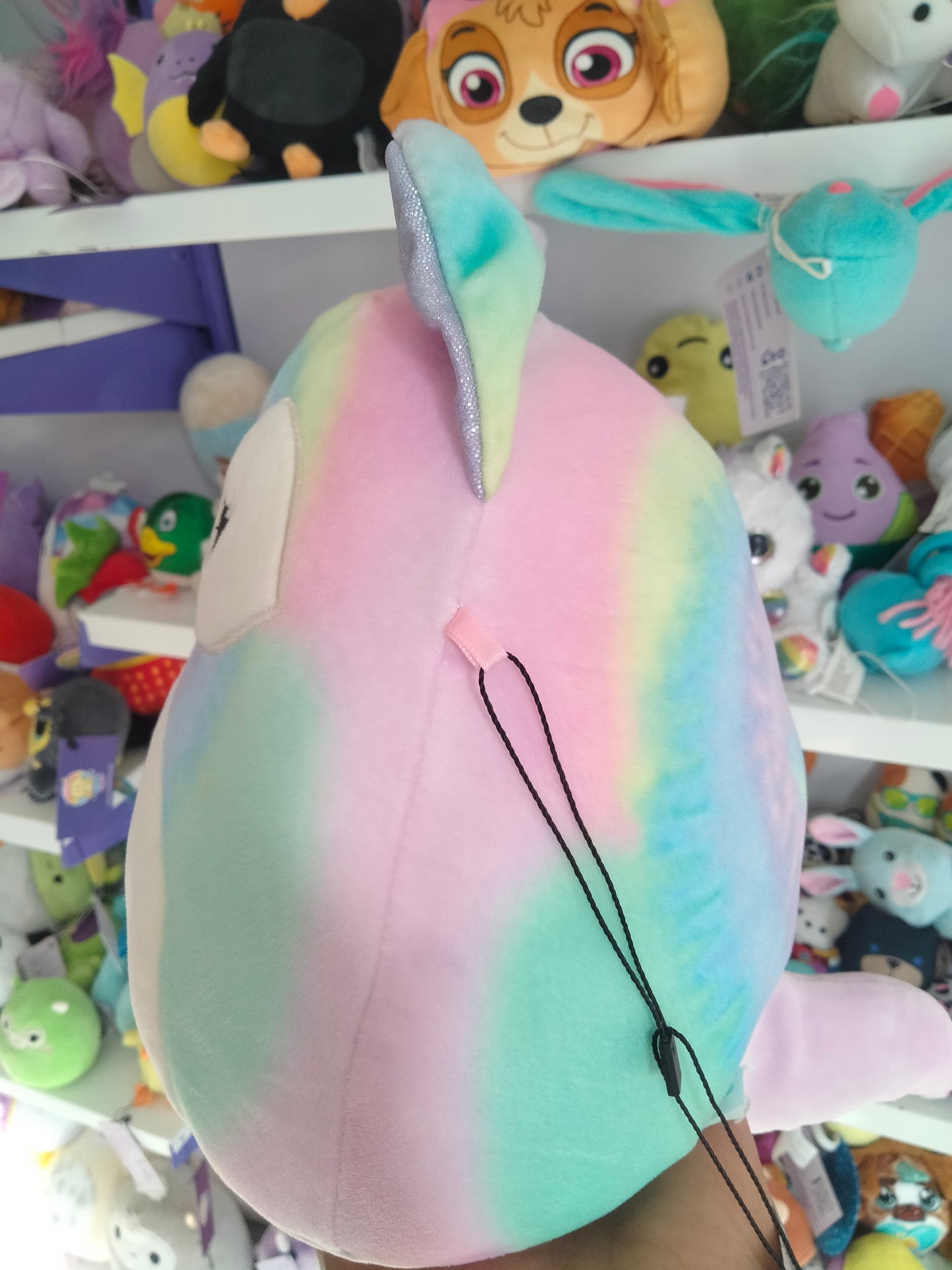 Squishmallows Felexine the Rainbow Fox plush toy.