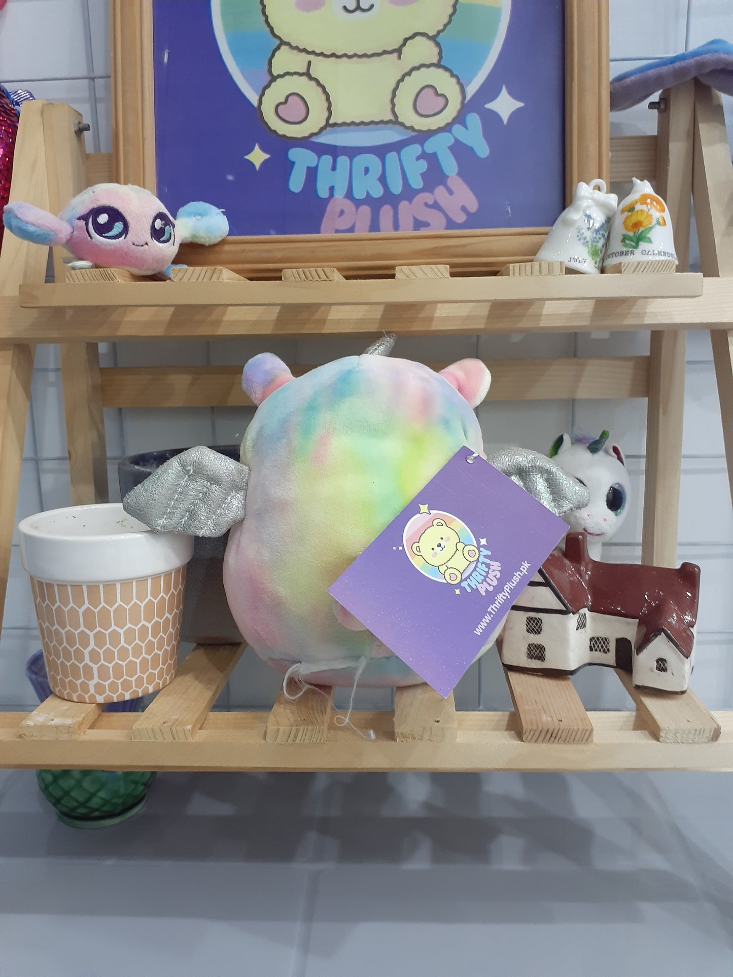 Squishmallow Named Lucy-May, A Rainbow Tie-Dye Llamacorn Plushie